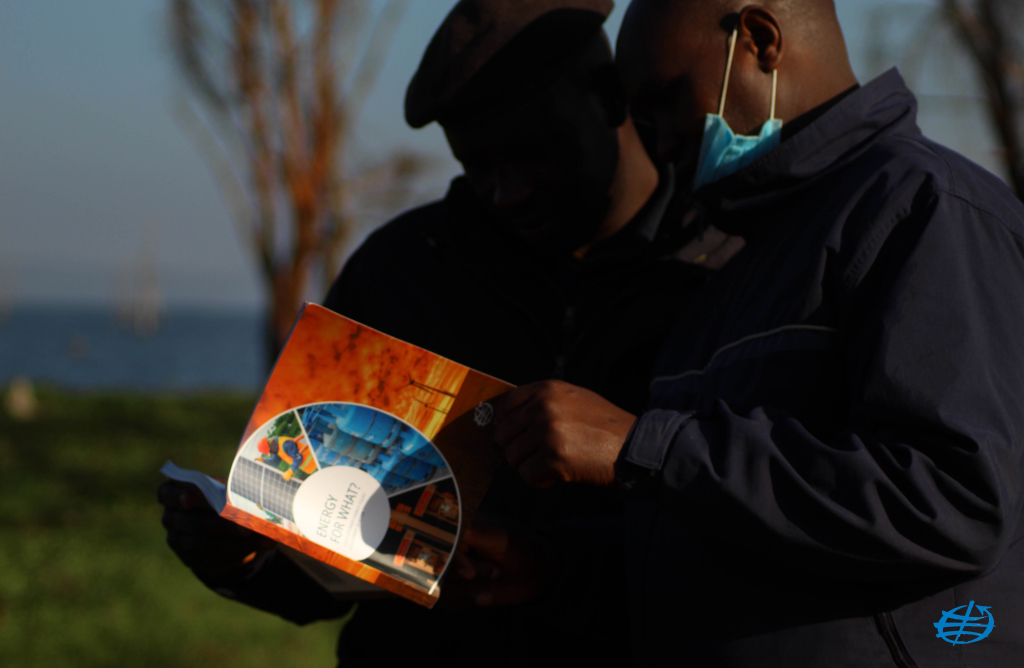 two men looking reading the publication